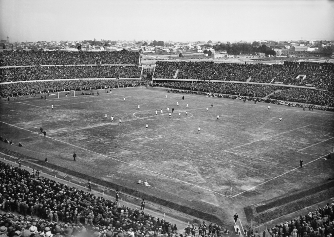 Match between Uruguay and Peru, the opening day of the Centenario Stadium. Front left: Olímpica stand; front right: Colombes stand. Back left: Ámsterdam stand; back right: América stand. July 18th, 1930.