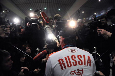 Grigory Sysoyev. Russia’s Irek Zaripov, four-time Paralympic winner, swamped by the press at Domodedovo airport. Moscow, Russia