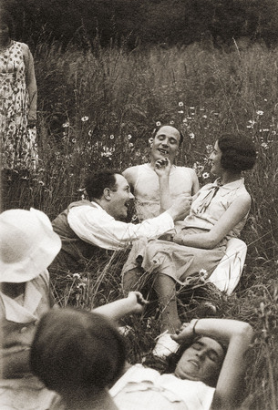 Young people in a meadow.
about 1936.
France is paralysed by strikes. In June 1936 the new Popular Front government approved a law to adopt paid leave, a reduction in working times, union rights and compulsory schooling to the age of 14. 
This new paid gave more than 600,000 French workers their first holiday. 
Anonyme © Haa /DR