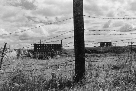 Robert Knoth.
Fence and Deserted Factory, Muslumovo. 
2001. 
When it became known, how much Tetcha was polluted with radioactive waste products, a fence was built along a coast, so that the inhabitants did not approach to the water. Nowadays deserted metal fabric located on a coast of Tetcha, that used to take wate.