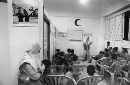 Jean Mohr.
Deir El Balah, Gaza. Awareness-raising session on the danger of anti-personnel mines conducted by the Palestine Red Crescent Society. 
2002