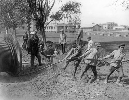 Installation of electrocable in Oktyabrsky village. 
1931. 
From the Russian state archive of film-photo documents of Krasnogorsk
