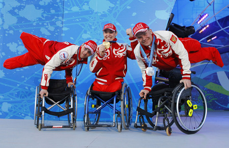 Ilya Pitalev. Russian biathletes Roman Petushkov, Irek Zaripov and Vladimir Kiselyov win bronze, gold and silver, respectively, in the 12.5 km biathlon event, sitting. Vancouver, Canada
