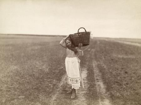 Alexey Mazurin.
The girl with a basket on a shoulder. 
The beginning of XX century. 
Collection of the Moscow House of photography