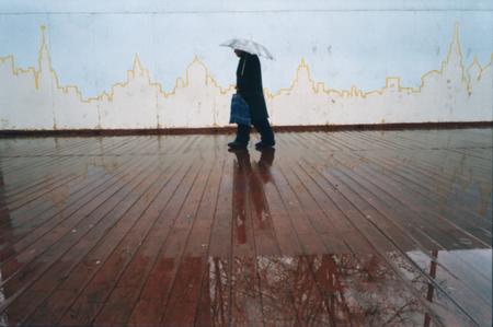 George Pervov.
Going under the umbrella against a background of the city cardiogram (Totalrealism). 
April 28, 2003. 
© Georgy Pervov