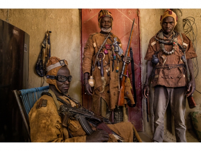 Pascal Maitre.
Mali, 2019.

Dozo traditional hunters from the Bambara people have been drafted into a militia. They are assisted and supported by the Malian government, which makes them fight against the Fula people, who have joined the Islamists. 

© Pascal Maitre/Myop/Panos.