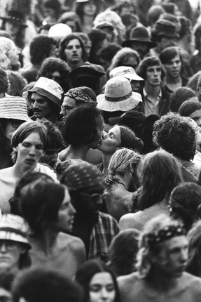 Jean-Pierre Laffont.
Watkins Glen July 73 Couple kissing in the crowd
Watkins Glen, NY. July 28th, 1973. 
The Summer Jam at Watkins Glen was a 1973 rock festival which once received the Guinness Book of World Records entry for 
