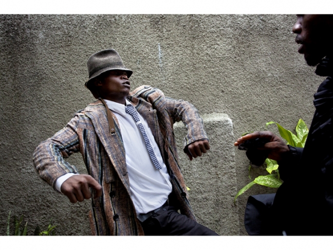 Pascal Maitre.
Congo, 2012.

The fashionable Sapeurs (a French
acronym for the “Society of Atmosphere-makers and Persons of Elegance”) of the Léopards du Congo group in the Matonge neighbourhood. They wear second-hand clothes by leading designers such as Yamamoto, Dolce & Gabbana, and Paul Smith. The Sape fashion statement first appeared in the late 1970s as a reaction to the ‘authenticity’ advocated by Mobutu, who banned western-style clothing.

© Pascal Maitre/Myop/Panos.