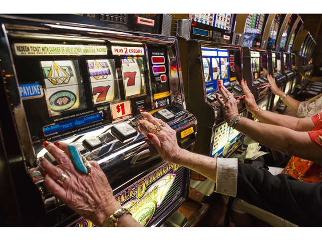 © Lauren Greenfield. Slot machines at New York New York Hotel & Casino, Las Vegas, 2008. Since 1999, non-gaming revenue on the Vegas Strip exceeds gambling profits, with mega-nightclubs becoming star attractions in the new Vegas.
<br />
Credit: Lauren Greenfield/INSTITUTE