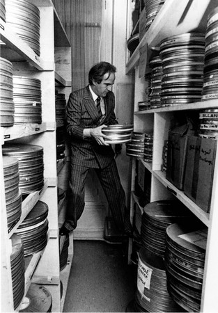 Pierre Boulat.
François Truffaut among his films collection 
May , 1981. 
© Pierre Boulat / COSMOS