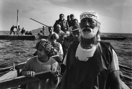 Sebastiano Salgado.
Fishermen gather in the early morning for a face of a tuna. Trapani, Sicily, Italy. 
1991