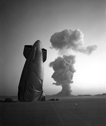 Operation name: Plumbbob.	
Date and time: August 7, 1957, 04:25.
Test location: Range in Nevada.
Explosion type, explosive placement: aerial, balloon. 
Explosion height: 450 m.
Yield: 19 kilotons.

The ZSG-3 airship, downed by the shock wave from the explosion. Photograph taken from a distance of 8km from the test site.

Photo: unknown author.
Source: National Archives and Records. Administration, Washington