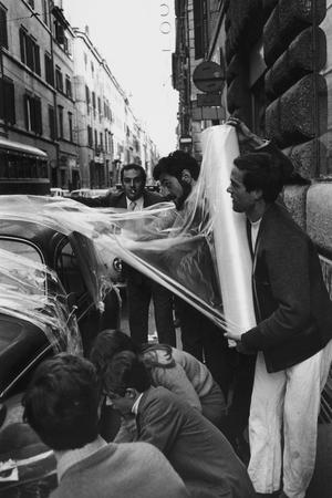Claudio Abate.
Gastone Novelli and his pupils from the Academia di Belle Arti, rapping a 600 Fiat in front of Feltrinelli bookshop. 
Author's collection, Italy