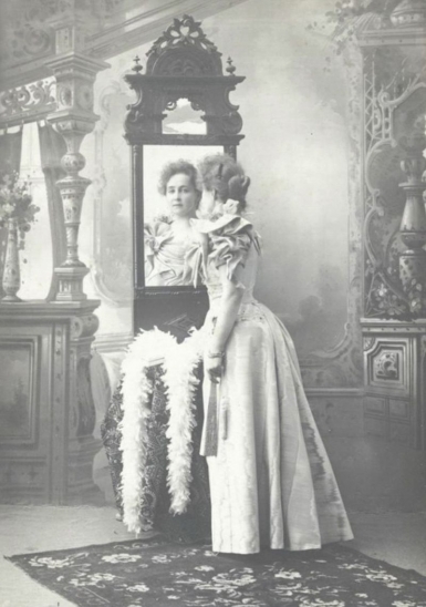Portrait of young lady by mirror