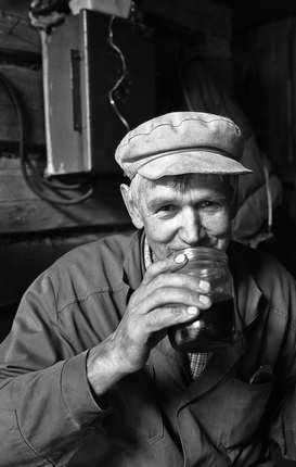 Yuri Rost.
Tractor driver drinks tea from a jar, Arkhangelsk region, Russia